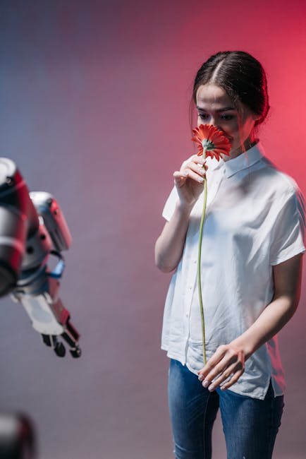 Industrial robot collaborating with a worker in a modern factory